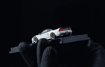 White sports car model on a black background