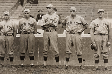 Five boston red sox baseball players standing in a line.