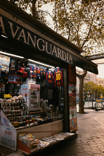 Newsstand with barcelona fc merchandise and evian water