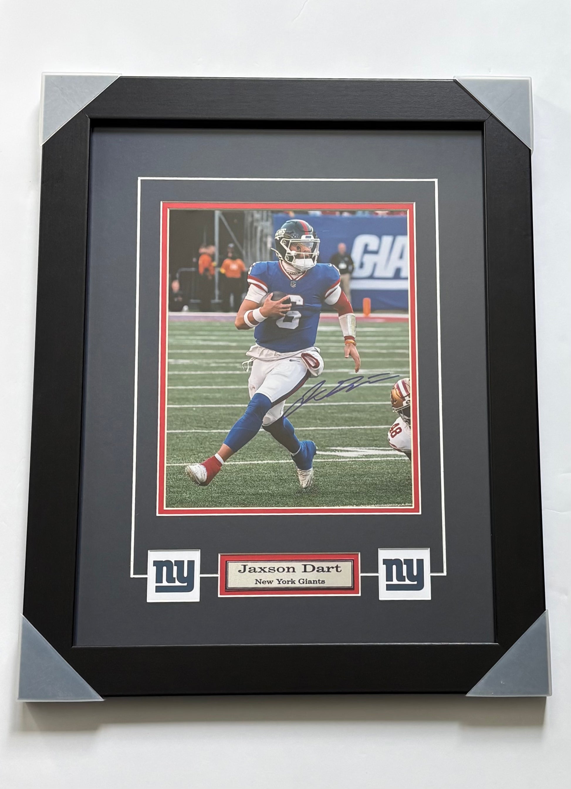 Framed and autographed photo of New York Giants quarterback Jayson Dart, 